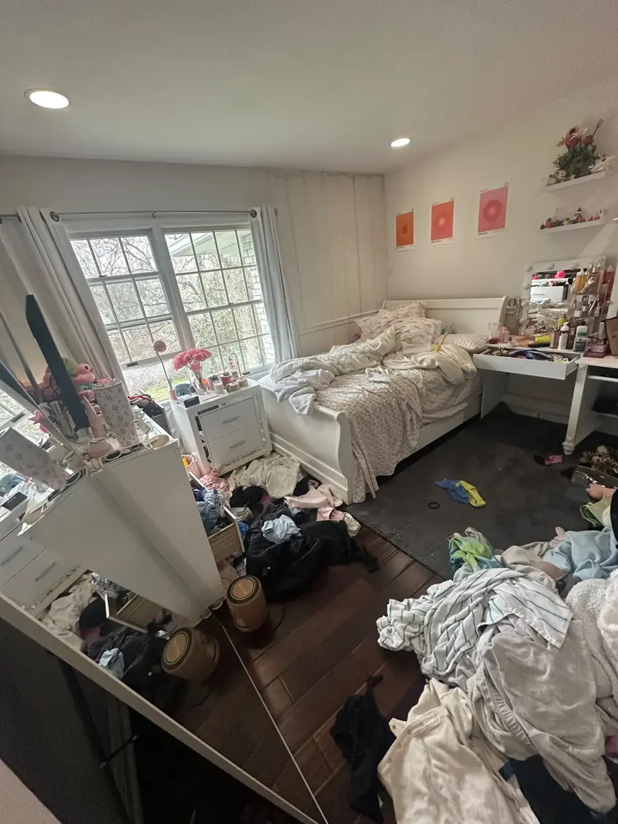 Bedroom reset: floors cleared, bed made, surfaces dusted, before cleaning